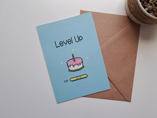 Birthday greeting card with Pixeled level up birthday cake