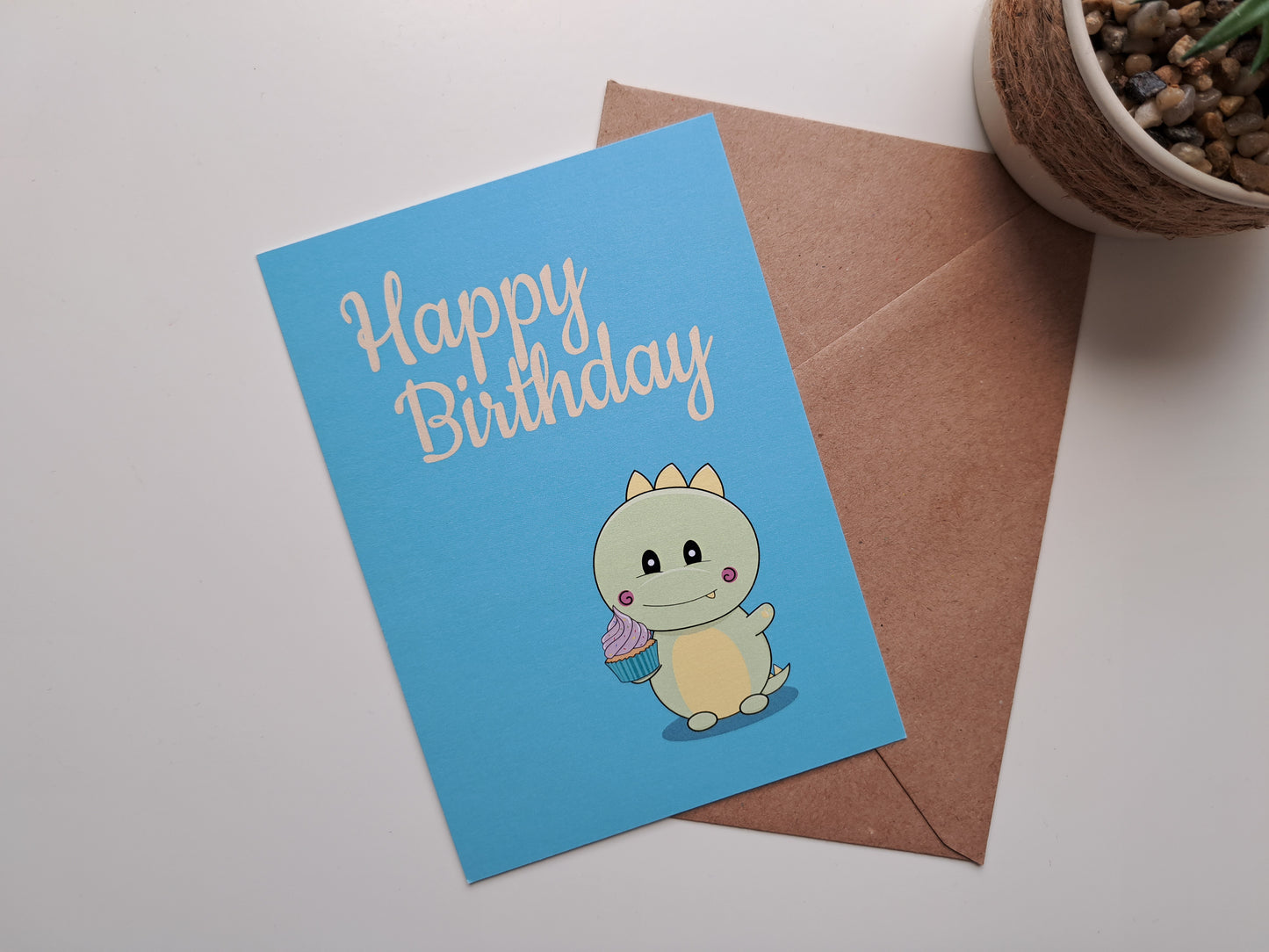 Birthday card with Dinosaur holding cupcake
