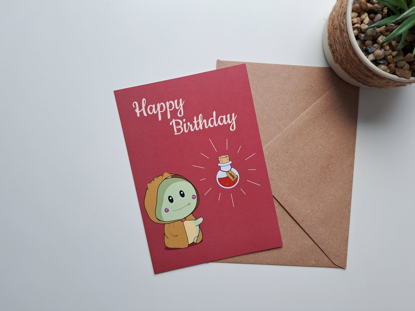Birthday greeting card with Dinosaur staring at vitality potion