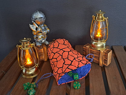 Handmade Dice bag made of orange fabric with black cracks in it