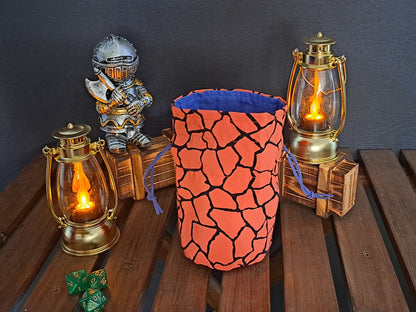 Handmade Dice bag made of orange fabric with black cracks in it