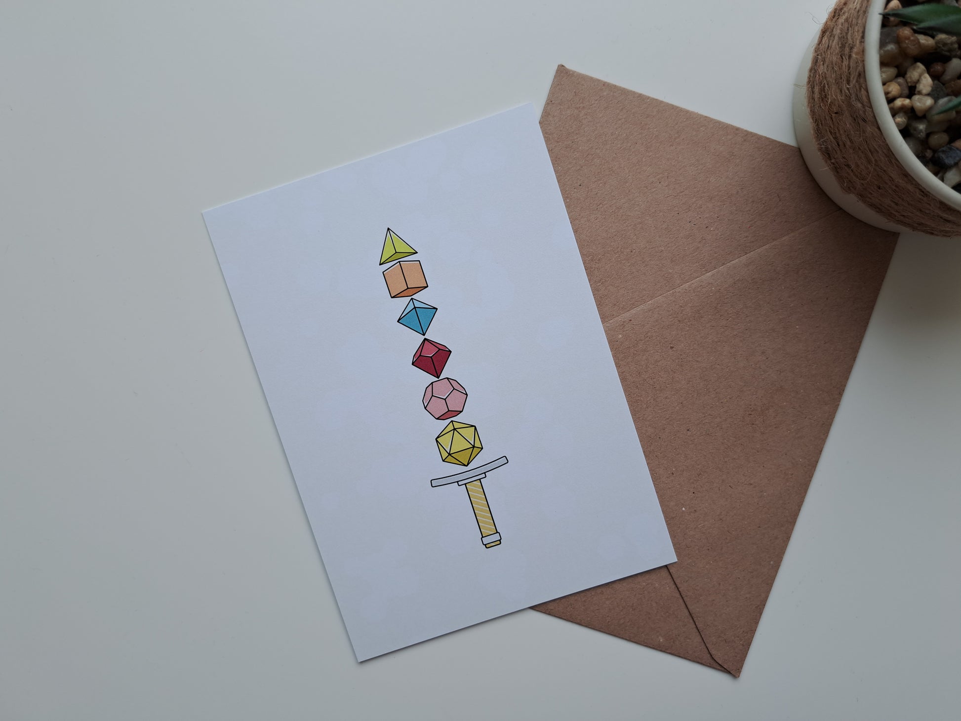 Gaming greeting card with sword made of dice