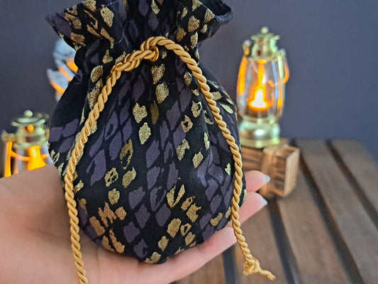 Zoomed in image of Handmade dicebag with dragon scale jersey pattern 
