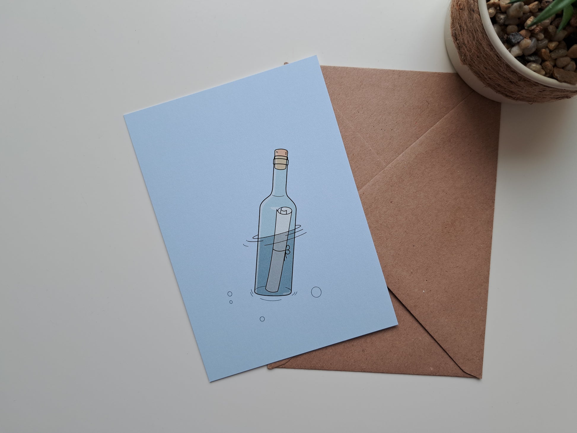 Thinking of you greeting card with message in a bottle.