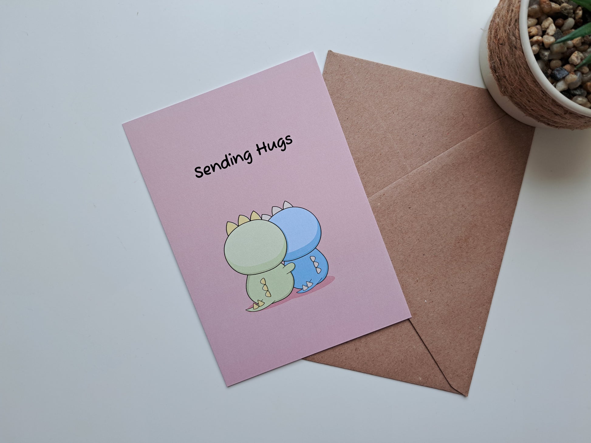 Thinking of you greeting card with Dinosaur giving another dinosaur a hug