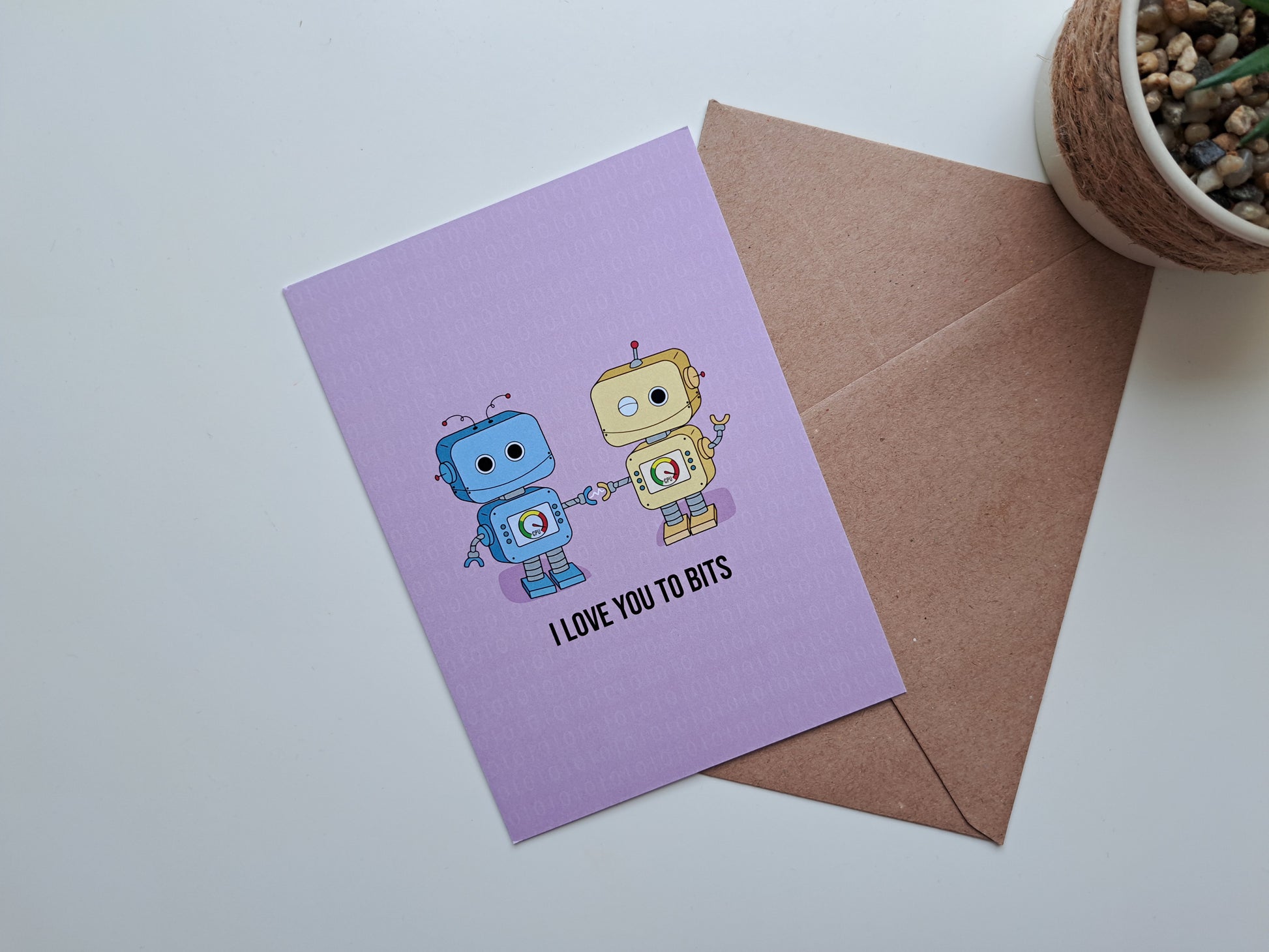Valentine's day greeting card with Robots in love and the text: I love you to bits